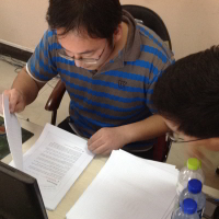 Hui and proofreader working on Community Informatics
              in China and the US book